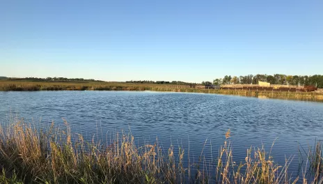 Inspecting dirty water containment ponds like this one daily is