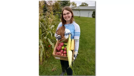 Hunter Gallagher with garden produce