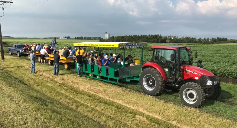 LREC Field Day photo showing attendees on the people carriers for the field tours.