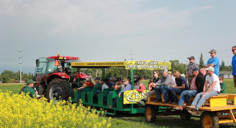 Picture of people sitting on the peoplecarriers at an annual LREC Field Day event.