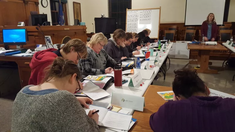 women learning in a class