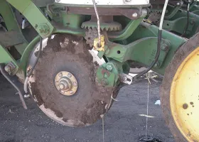 Photo 2. Planter set for in-furrow fertilizer placement.