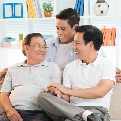 Three men in a family photo: a grandfather, son, and grandson