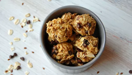 Energy Bites in a bowl on a wood surface