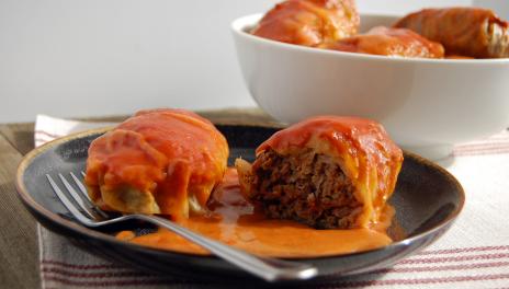 Halupsi (Cabbage Rolls), prepared and served on a plate with a fork