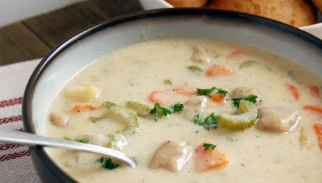 Knoephla Soup, served in a bowl with bread