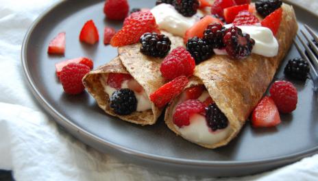 Stuffed French Toast Wraps, prepared and served on a plate with berries