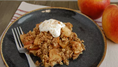 Slow Cooker Harvest Apple Crisp, served with whipped cream