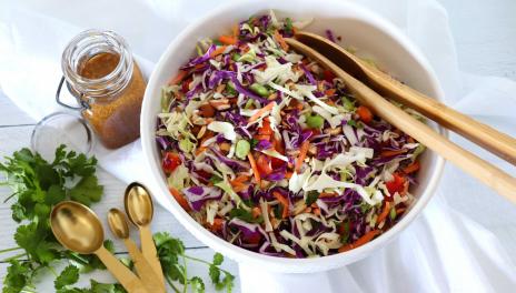 salad bowl with cabbage salad mix with dressing on the side