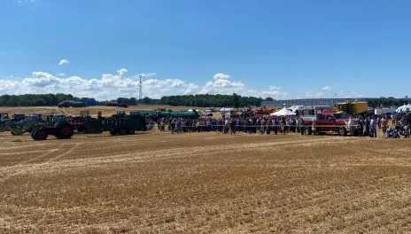 North American Manure Expo attendees watch side-by-side comparisons of solid (foreground) and liquid (background, center) manure spreading equipment.