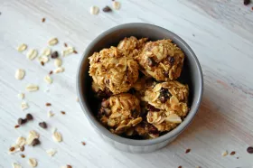 Energy Bites in a bowl on a wood surface