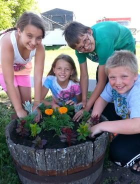 Children planting flowers 